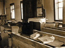 Ark, pews, lecterns, and prayer books in Bershad synagogue, 1991 (courtesy of Rita Ostrovskaya, “Jews in Ukraine, Shtetls”)